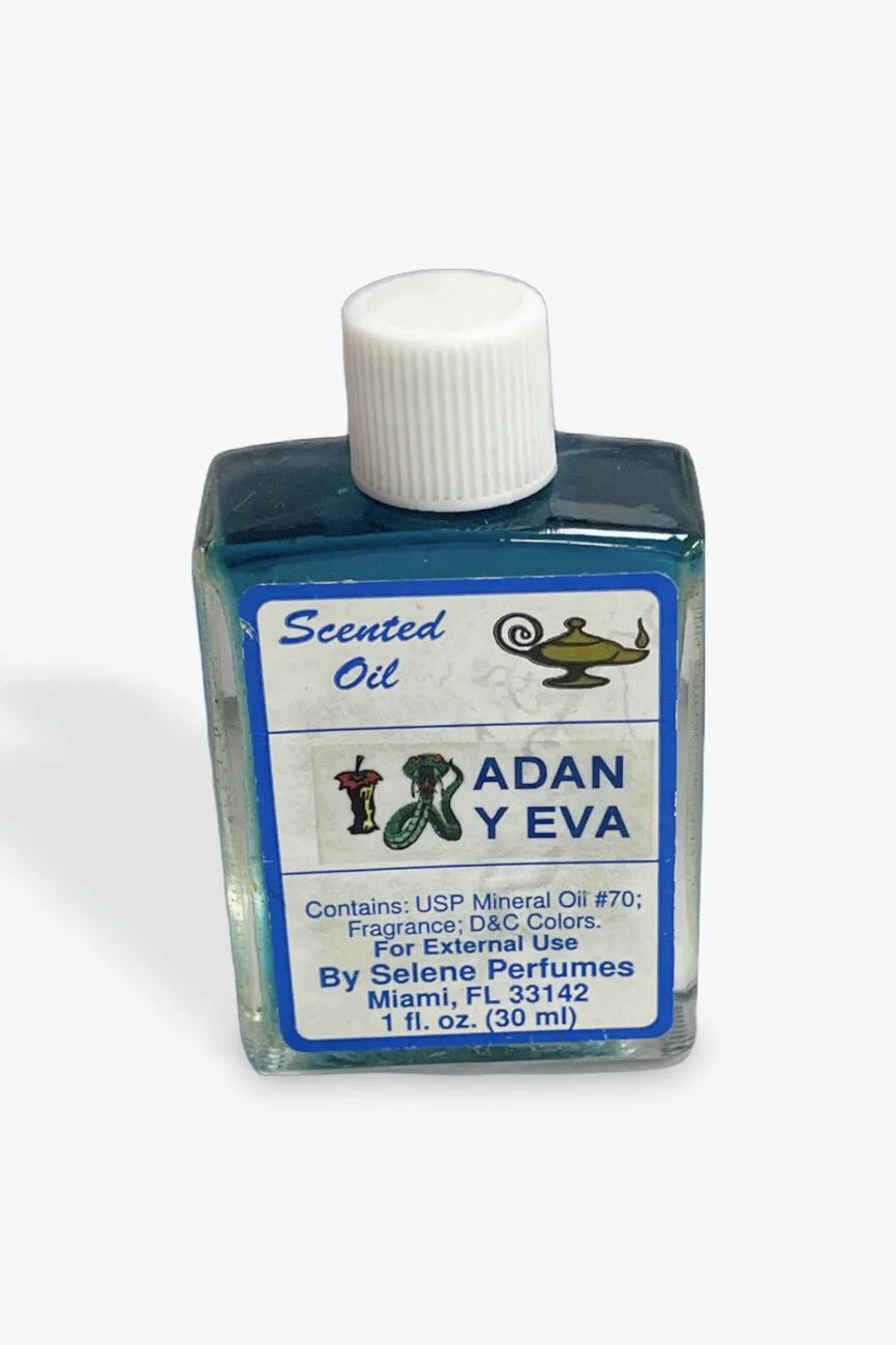 Blue bottle of Adan y Eva scented oil by Selene Perfumes
