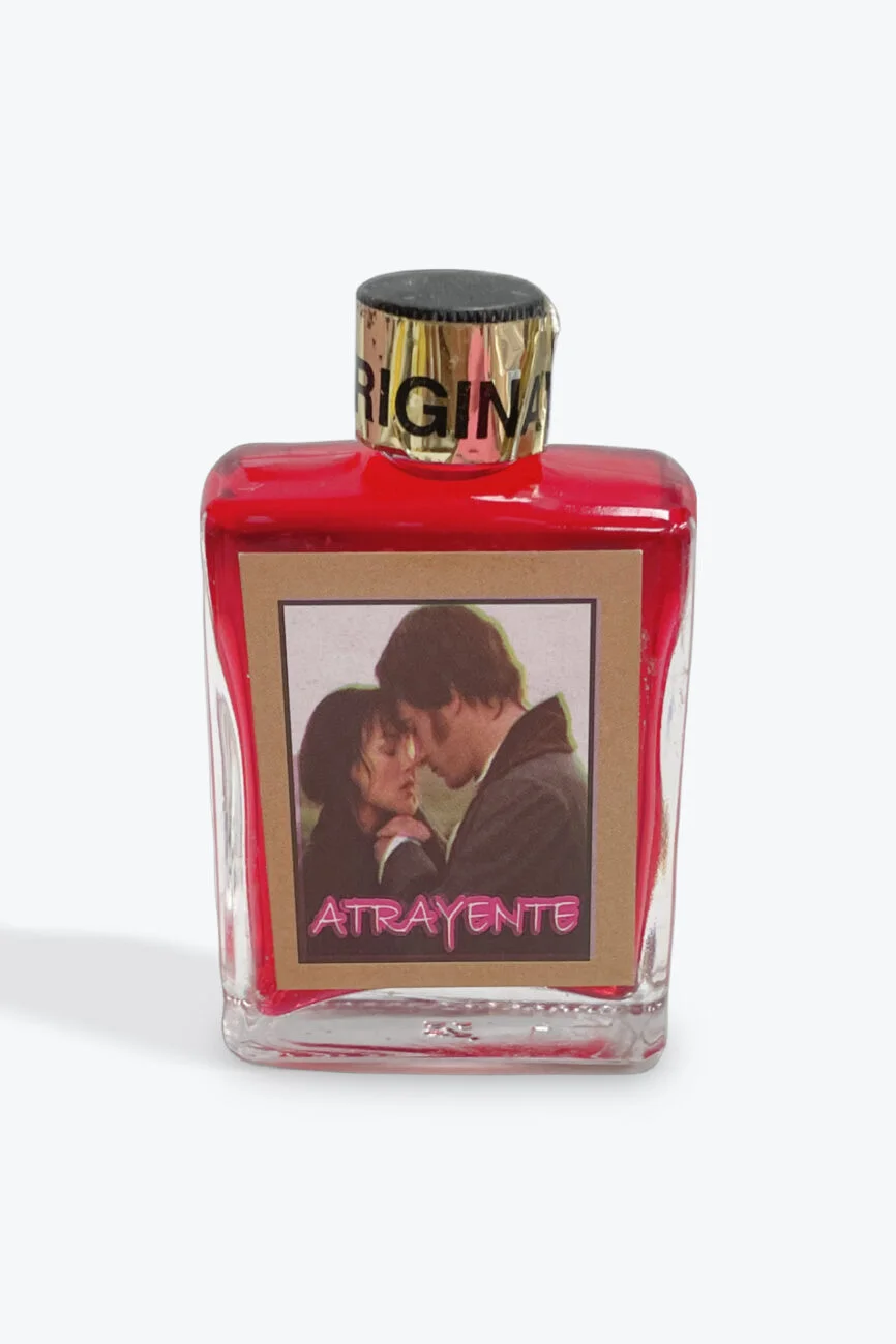 Red bottle of Atrayente love essence with a romantic couple image